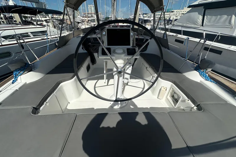 Slide: The Image of Cockpit of 2013 Beneteau Oceanis 37 sailboat with steering wheel and navigation equipment. - 14