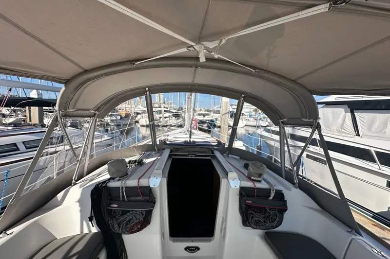 Slide: The Image of Beneteau Oceanis 37 sailboat cockpit, 2013 model, docked at marina with canopy cover. - 15
