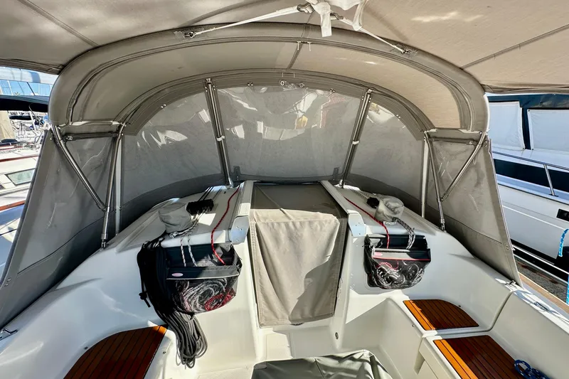 Slide: The Image of 2013 Beneteau Oceanis 37 cockpit with protective canopy and seating. - 16
