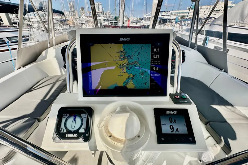 Slide: The Image of Cockpit of 2013 Beneteau Oceanis 37 with navigation instruments and chart display. - 22