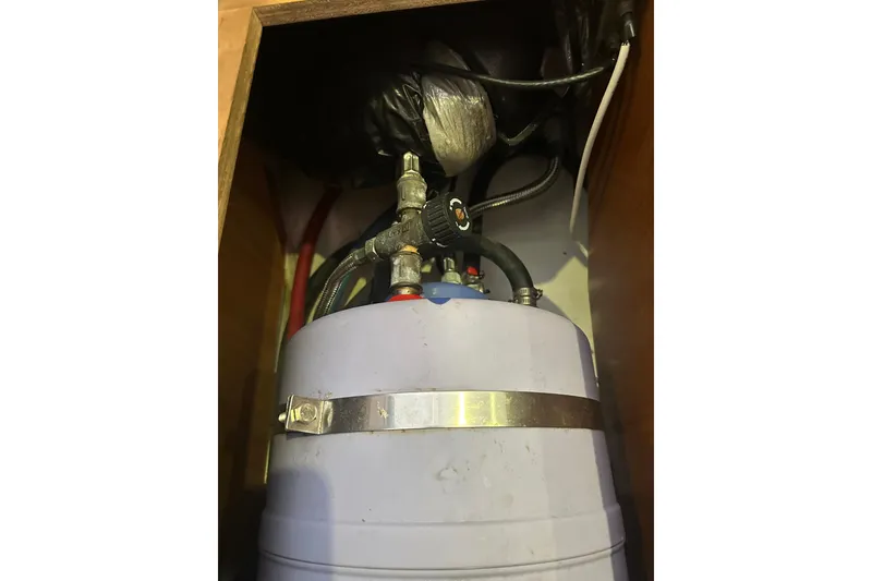 Slide: The Image of Water heater system inside 2013 Beneteau Oceanis 37 yacht compartment. - 24