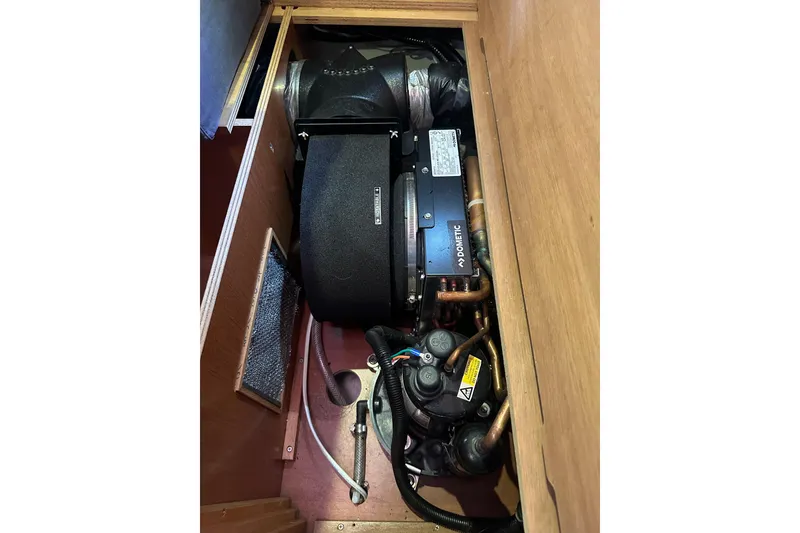 Slide: The Image of Engine compartment of a 2013 Beneteau Oceanis 37 sailboat, featuring Dometic equipment. - 25