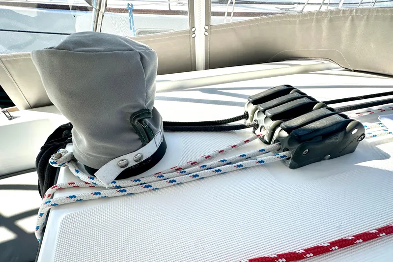 Slide: The Image of Deck of 2013 Beneteau Oceanis 37 sailboat with ropes and winch cover. - 28
