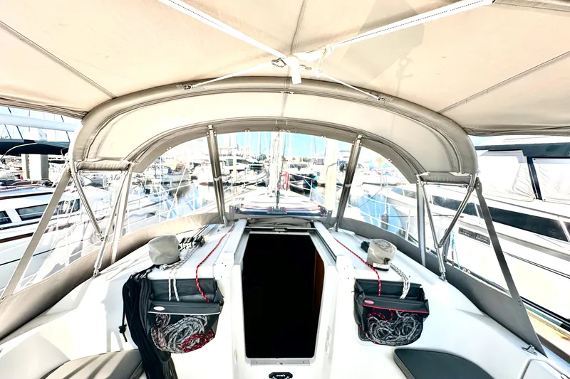 Slide: The Image of 2013 Beneteau Oceanis 37 sailboat cockpit with canopy, docked at marina. - 29