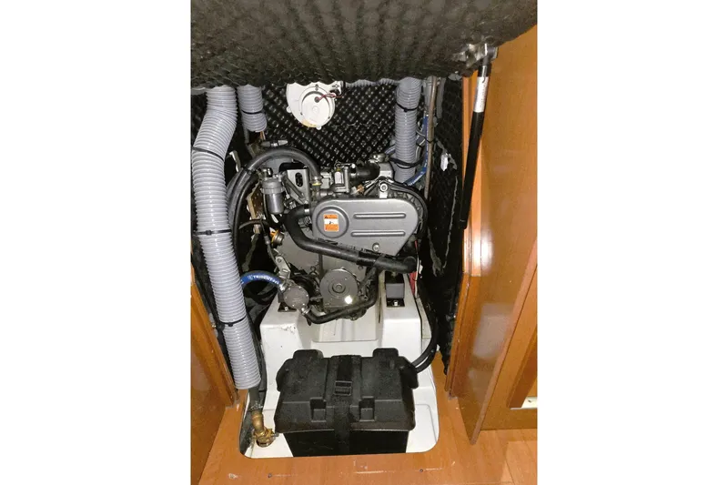 Slide: The Image of Engine compartment of a 2013 Beneteau Oceanis 37 sailboat, showcasing mechanical components. - 32
