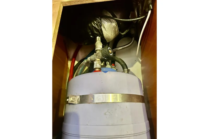 Slide: The Image of Water heater system inside 2013 Beneteau Oceanis 37 yacht, featuring pipes and fittings. - 34