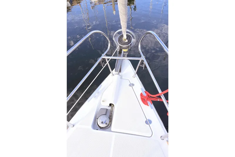 Slide: The Image of Bow of 2013 Beneteau Oceanis 37 sailboat with stainless steel railings and red rope. - 37