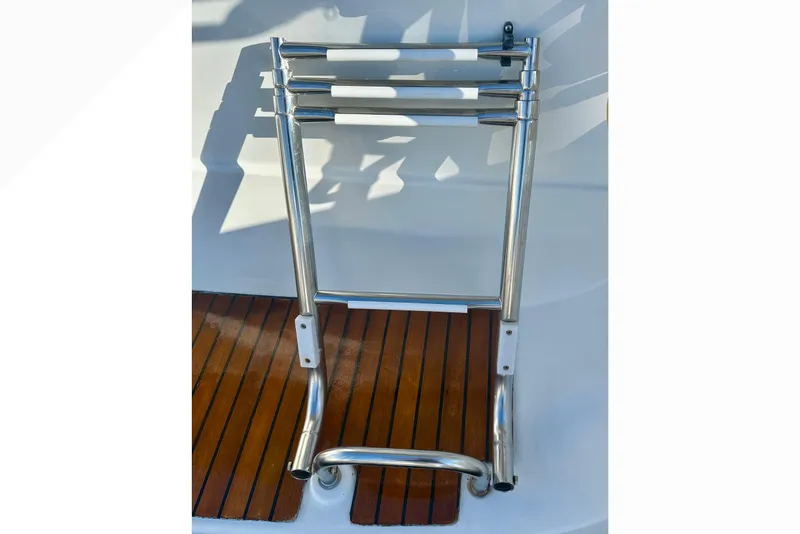 Slide: The Image of Stainless steel swim ladder on 2013 Beneteau Oceanis 37 yacht deck. - 38