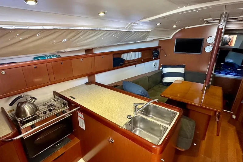Slide: The Image of Interior of 2013 Beneteau Oceanis 37 yacht with kitchen and seating area. - 4