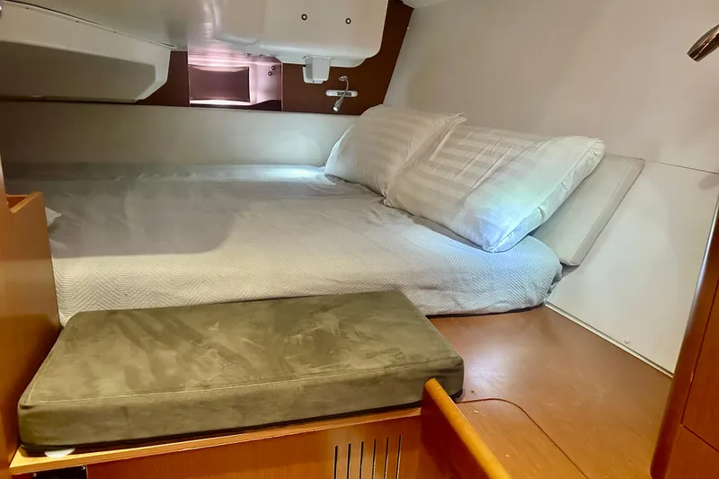 Slide: The Image of Cozy cabin interior of 2013 Beneteau Oceanis 37 sailboat with comfortable bedding. - 7