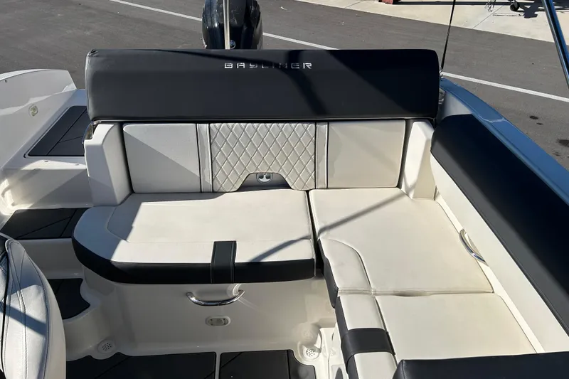 Slide: The Image of 2020 Bayliner DX 2000 boat interior with white and black seating. - 13