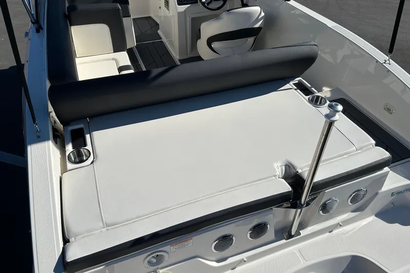 Slide: The Image of Bayliner DX 2000 2020 boat interior with seating and cup holders. - 14