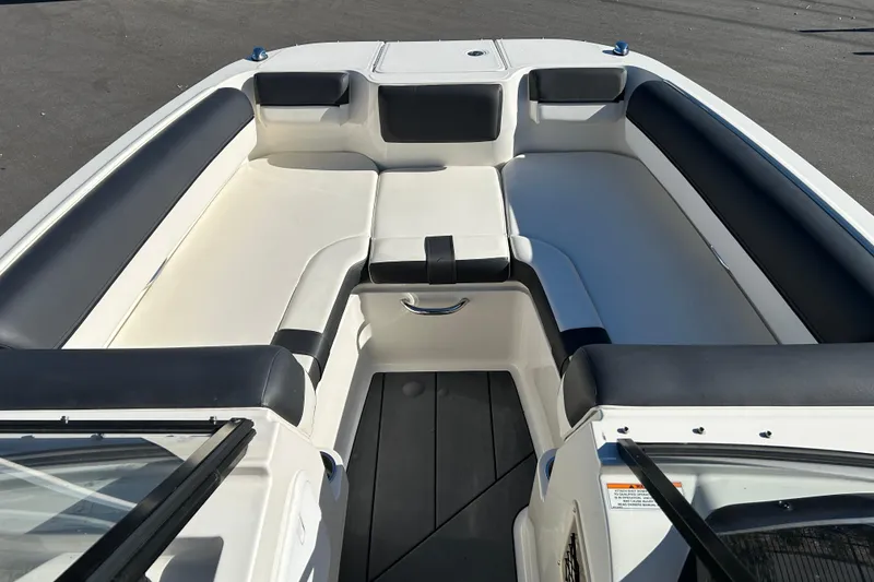 Slide: The Image of 2020 Bayliner DX 2000 boat interior with white and black seating. - 8