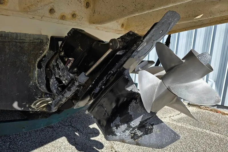 Slide: The Image of 1999 Sea Ray 270 Sundancer boat deck with teak-style flooring and circular hatches. - 18