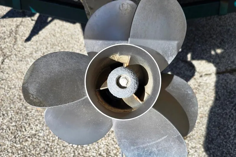 Slide: The Image of 1999 Sea Ray 270 Sundancer boat stern with ladder and propeller visible. - 19