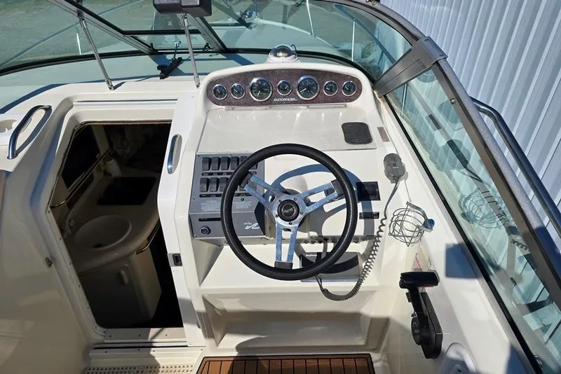 Slide: The Image of Close-up of a 1999 Sea Ray 270 Sundancer boat propeller on a textured surface. - 21