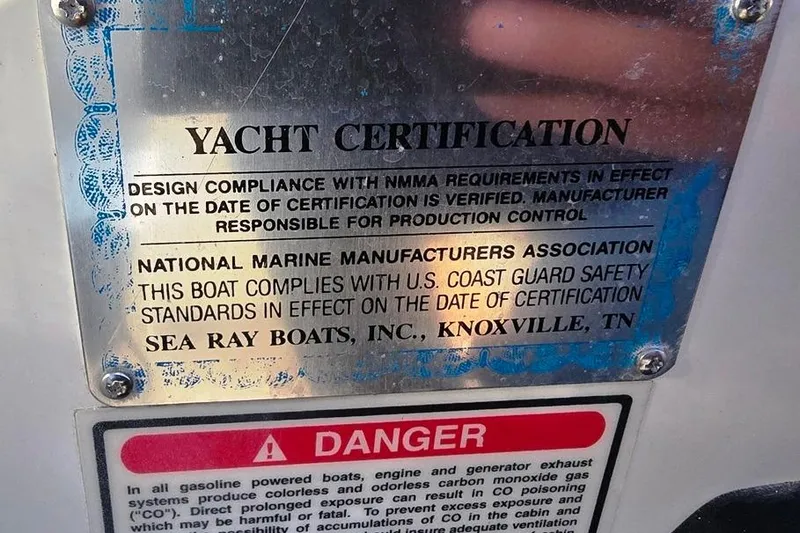 Slide: The Image of Yacht certification plaque for 1999 Sea Ray 270 Sundancer, compliance with NMMA and U.S. Coast Guard standards. - 26