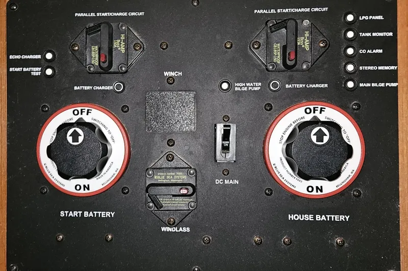 Slide: The Image of Control panel of a 2004 Hunter 386 sailboat with battery switches and circuit breakers. - 17
