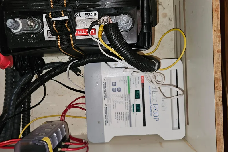 Slide: The Image of Battery and power control system in a 2004 Hunter 386 boat. - 18