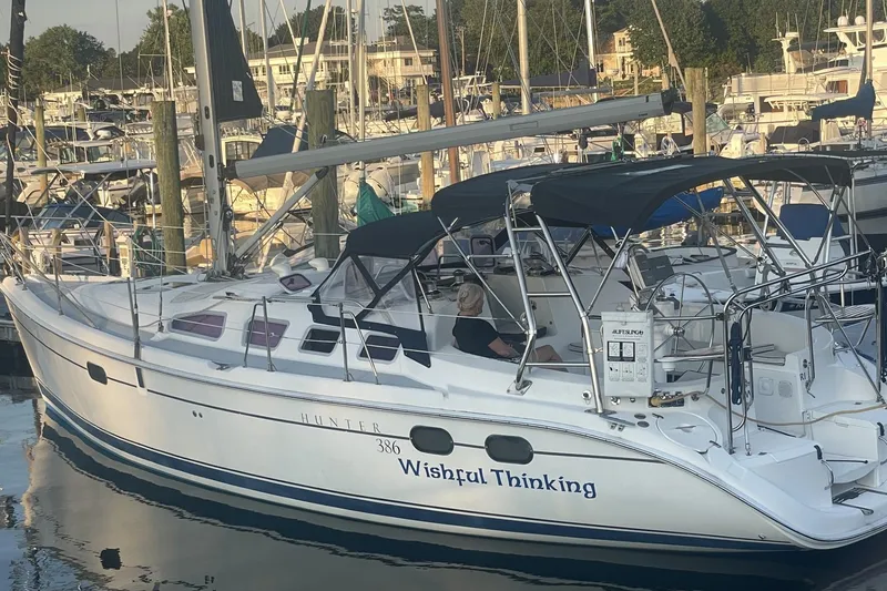 Slide: The Image of Hunter 386 sailboat named "Wishful Thinking" docked at marina, 2004 model. - 2