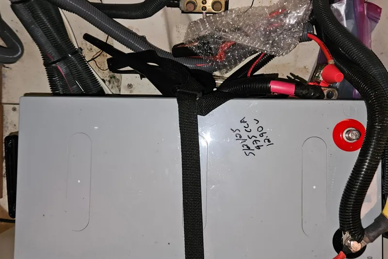 Slide: The Image of Battery installation in a 2004 Hunter 386 sailboat with wiring and connectors. - 20
