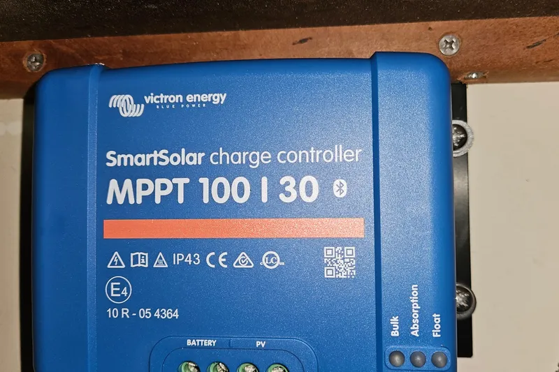 Slide: The Image of Victron Energy SmartSolar MPPT 100/30 charge controller on Hunter 386, 2004 model. - 21