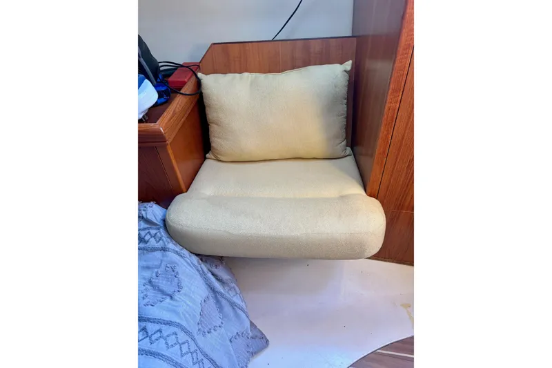 Slide: The Image of Cozy seating area in a 2004 Hunter 386 sailboat interior. - 8