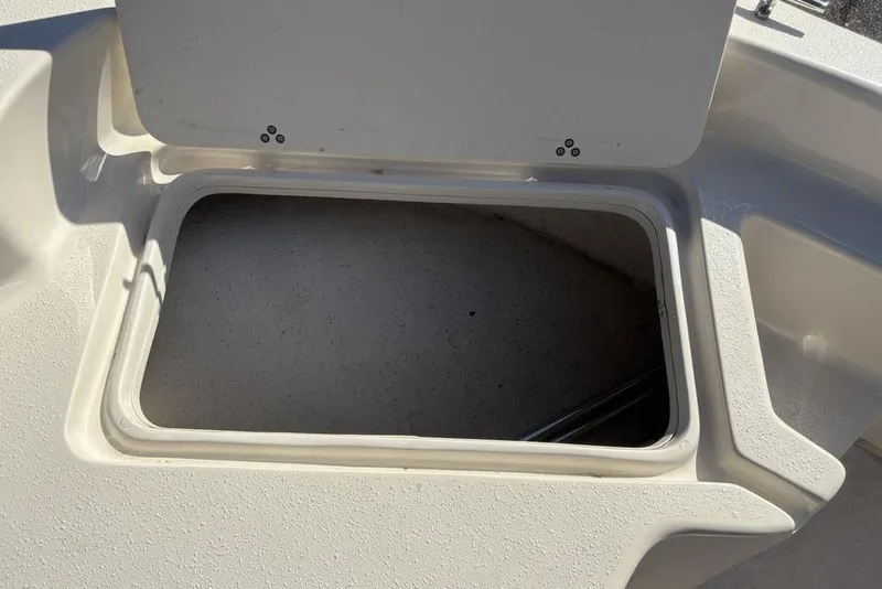 Slide: The Image of Open storage compartment on a 2017 Carolina Skiff 198 DLV boat. - 12