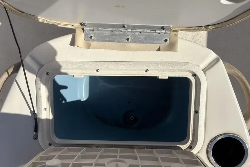 Slide: The Image of Open storage compartment on a 2017 Carolina Skiff 198 DLV boat. - 16