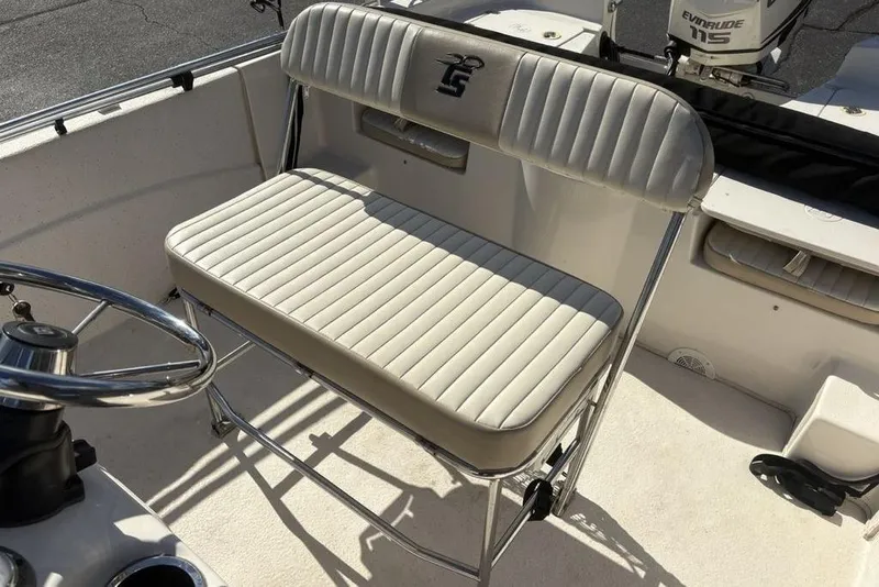 Slide: The Image of 2017 Carolina Skiff 198 DLV boat interior with steering wheel and cushioned seating. - 21