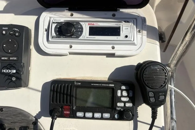 Slide: The Image of Control panel of a 2017 Carolina Skiff 198 DLV with radio and navigation equipment. - 24