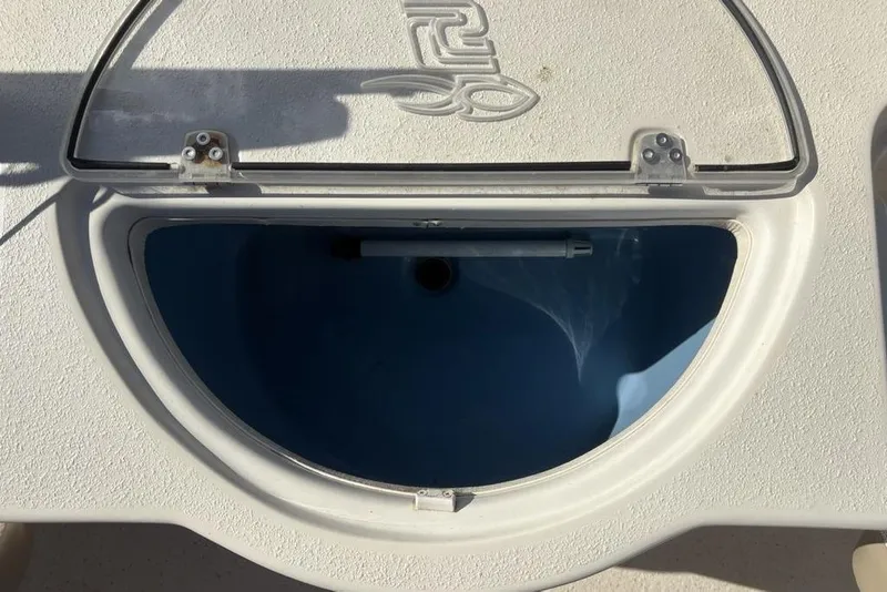 Slide: The Image of Open hatch on 2017 Carolina Skiff 198 DLV boat, showing interior compartment. - 25