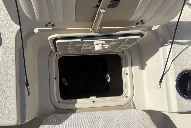 Slide: The Image of Open storage compartment on a 2017 Carolina Skiff 198 DLV boat. - 26