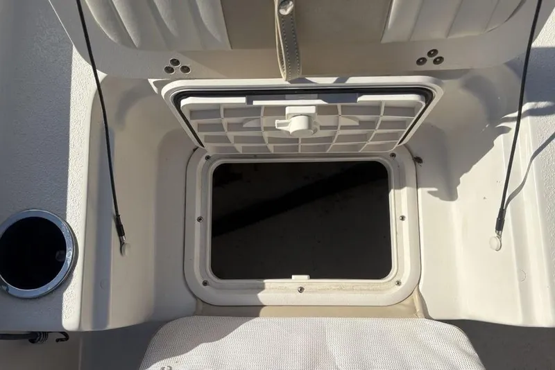 Slide: The Image of Open storage compartment on a 2017 Carolina Skiff 198 DLV boat. - 27