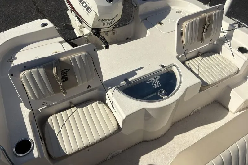 Slide: The Image of 2017 Carolina Skiff 198 DLV boat interior with seating and Evinrude motor. - 29