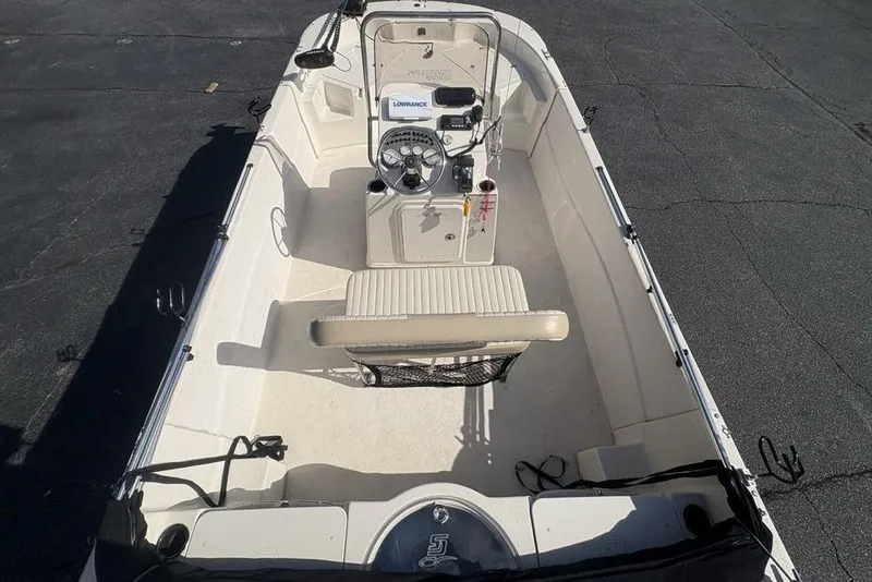 Slide: The Image of 2017 Carolina Skiff 198 DLV boat interior with steering console and seating. - 30