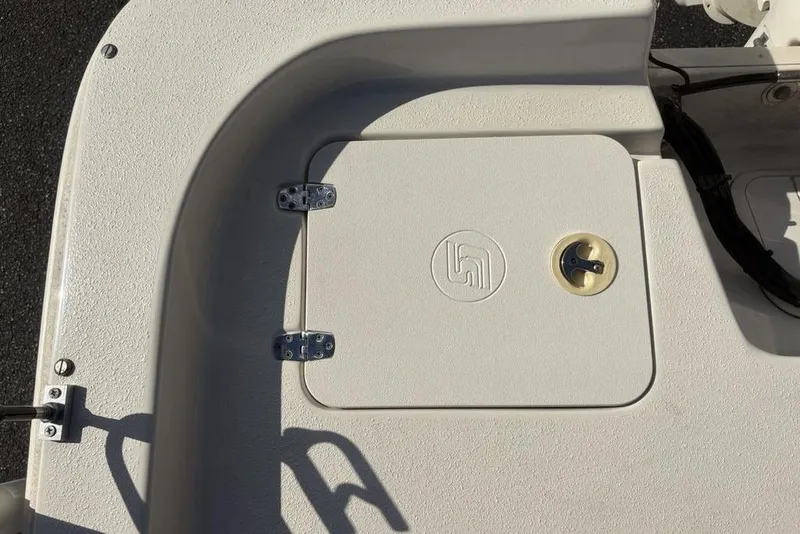Slide: The Image of 2017 Carolina Skiff 198 DLV boat hatch with embossed logo and latch. - 31
