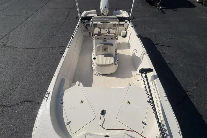 Slide: The Image of 2017 Carolina Skiff 198 DLV boat interior with seating and storage compartments. - 32