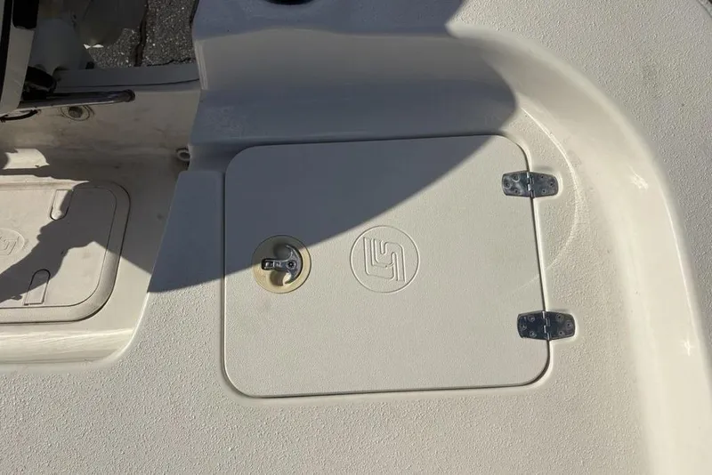 Slide: The Image of 2017 Carolina Skiff 198 DLV boat hatch with lock and hinges. - 33