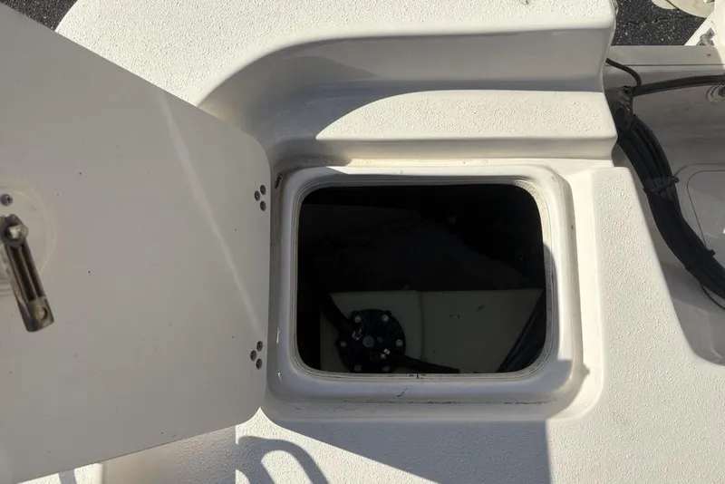 Slide: The Image of Open storage compartment on a 2017 Carolina Skiff 198 DLV boat. - 35