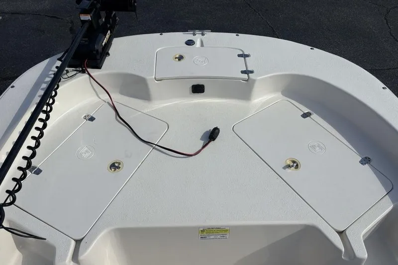 Slide: The Image of 2017 Carolina Skiff 198 DLV boat deck with storage compartments and trolling motor. - 8