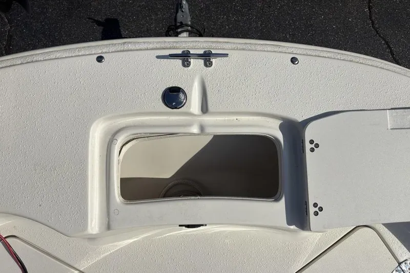 Slide: The Image of 2017 Carolina Skiff 198 DLV boat deck with storage compartment open. - 9