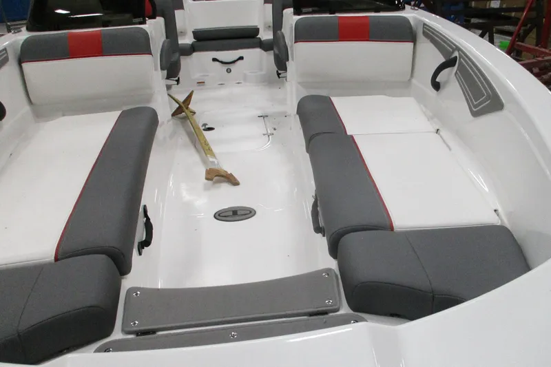 Slide: The Image of 2025 Tahoe T21 boat interior with gray and red seating, spacious layout. - 3