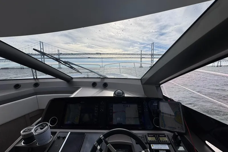 Slide: The Image of Interior view from 2022 Sunseeker Manhattan 55 yacht, overlooking a bridge on a cloudy day. - 16