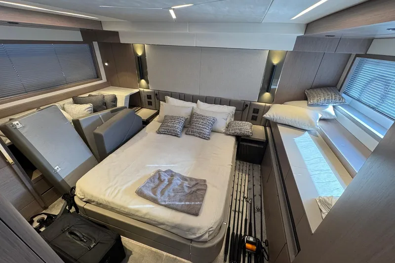 Slide: The Image of Luxurious bedroom interior of 2022 Sunseeker Manhattan 55 yacht, featuring modern design and cozy bedding. - 18