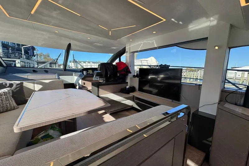 Slide: The Image of Luxurious interior of 2022 Sunseeker Manhattan 55 yacht with modern furnishings and large windows. - 23