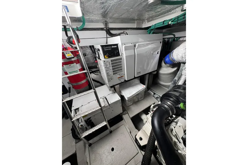 Slide: The Image of Engine room of 2022 Sunseeker Manhattan 55 yacht with Cummins Onan generator. - 25