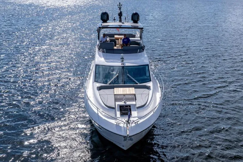 Slide: The Image of 2022 Sunseeker Manhattan 55 yacht cruising on open water, top view. - 3