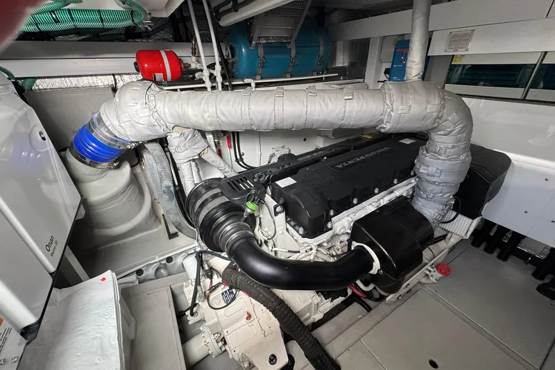 Slide: The Image of Engine room of 2022 Sunseeker Manhattan 55 yacht, featuring Volvo Penta engine and Onan generator. - 31