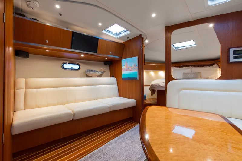 Slide: The Image of 2005 Tiara Yachts 3600 Sovran interior with elegant seating and wood finishes. - 2